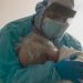 Photo of Doctor Who Worked For 256 Straight Days Goes Viral For Hugging a COVID-19 Patient